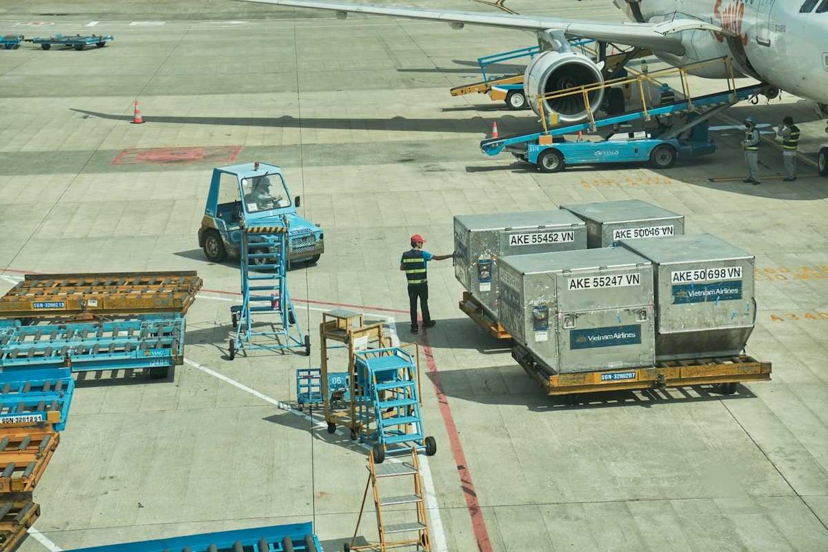 Air cargo containers being loaded onto an aircraft